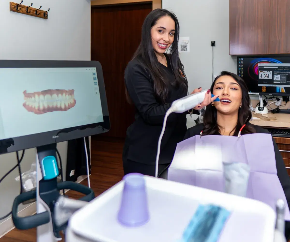 A team member demonstrating an intraoral scan.